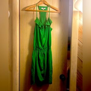 65% cotton, 35% polyester. Sleek emerald green dress